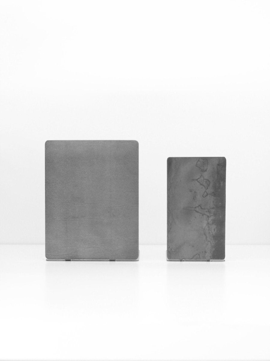 Two gray stone blocks on a white background