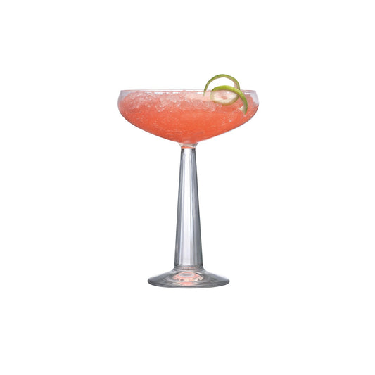 Cocktail in a coupe glass with a lime wheel on a white background
