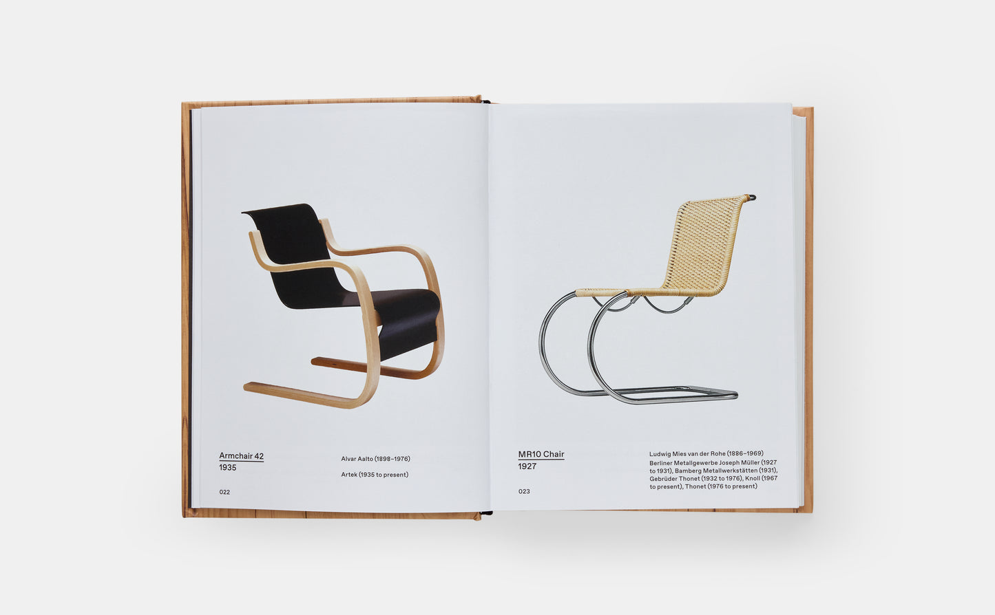 Open book displaying images of two chairs on a white background