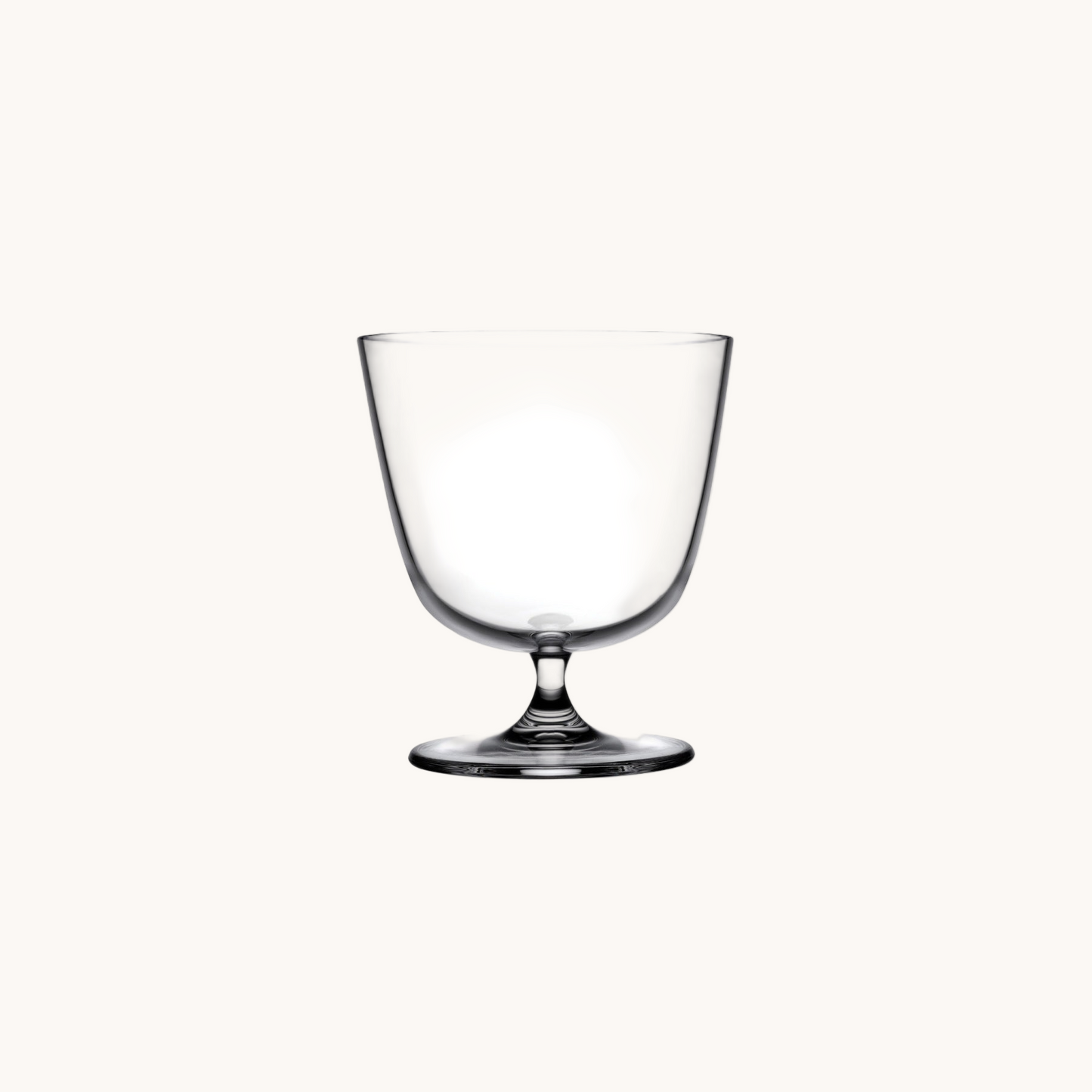 Clear glass goblet on a white background