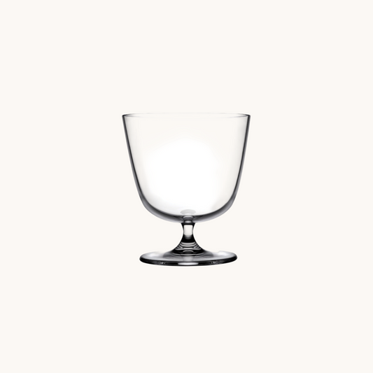 Clear glass goblet on a white background