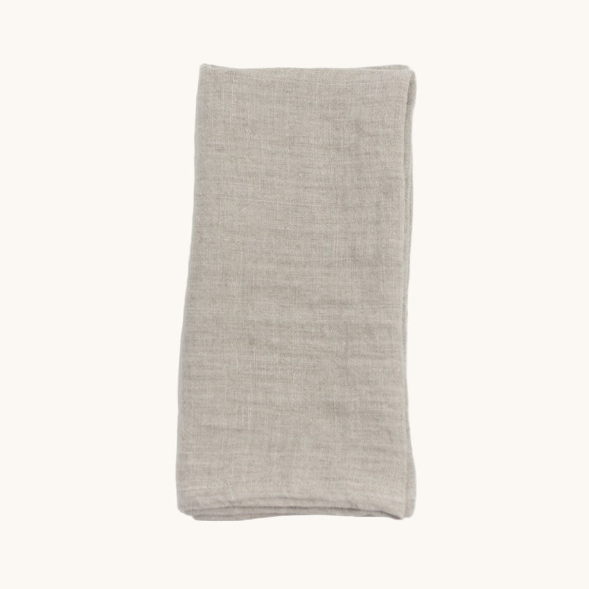 Folded beige fabric on a white background