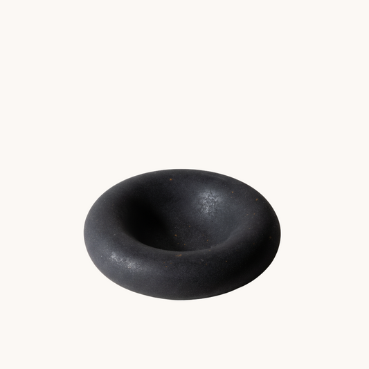 Black rubber donut on a white background