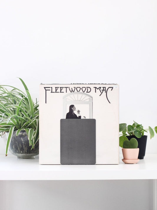 Fleetwood Mac album cover with potted plants on a white surface