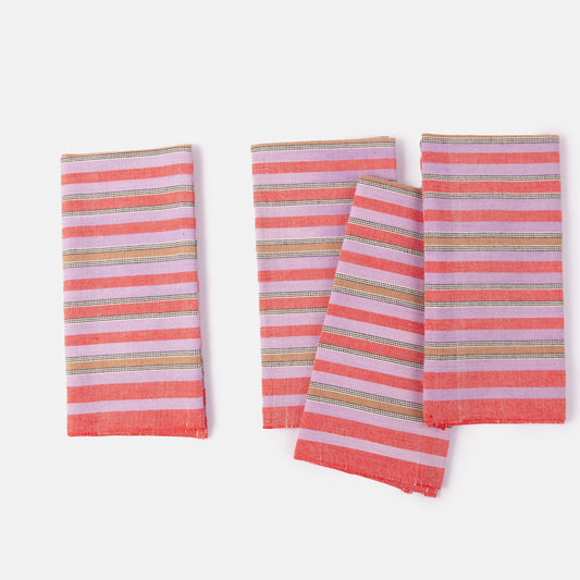 Set of three striped napkins with pink and multicolor pattern on a white background