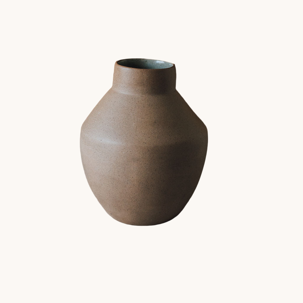 Brown ceramic vase on a white background