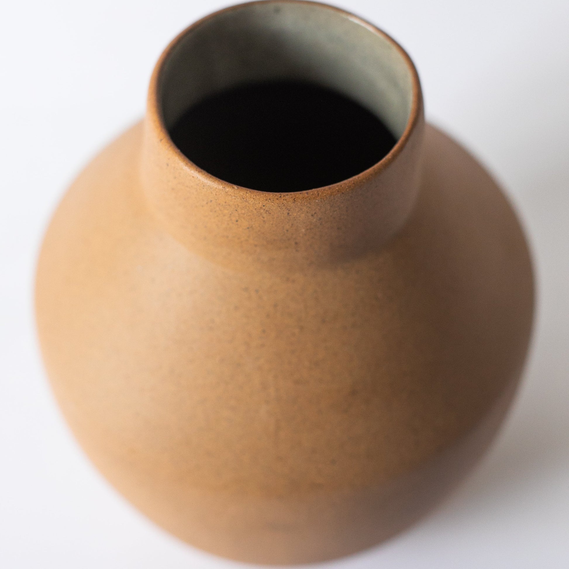 Brown ceramic vase on a white background