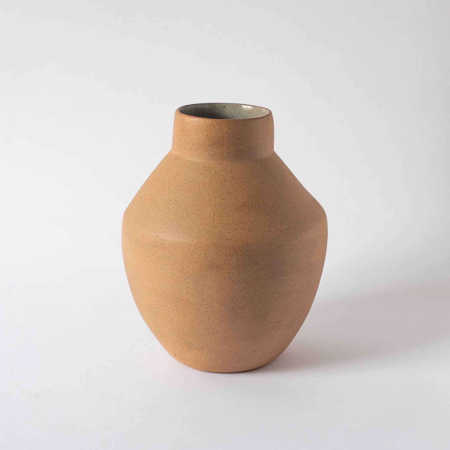 Brown ceramic vase on a white background