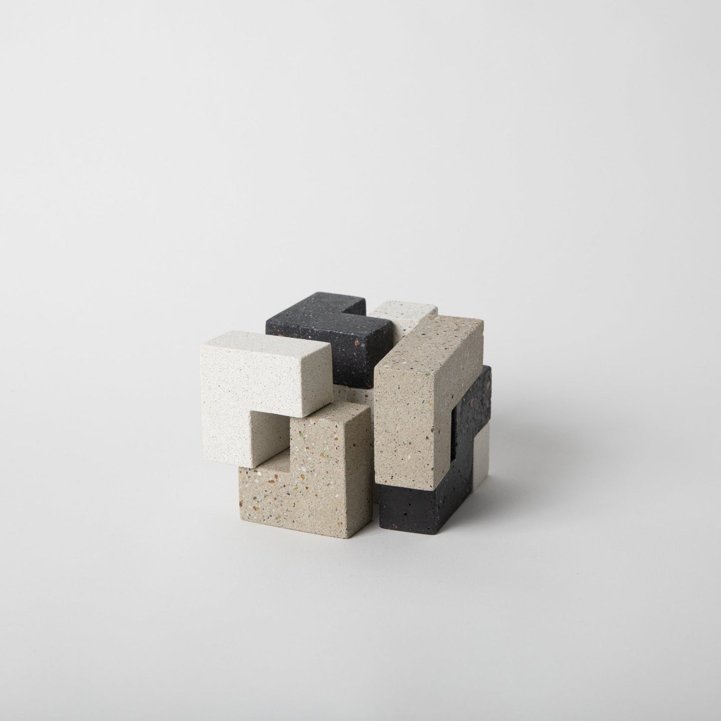 Concrete block sculpture on a white background