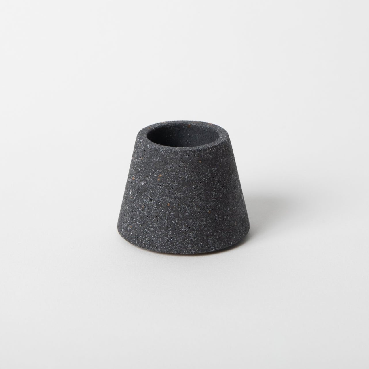 Black ceramic vase on a white background