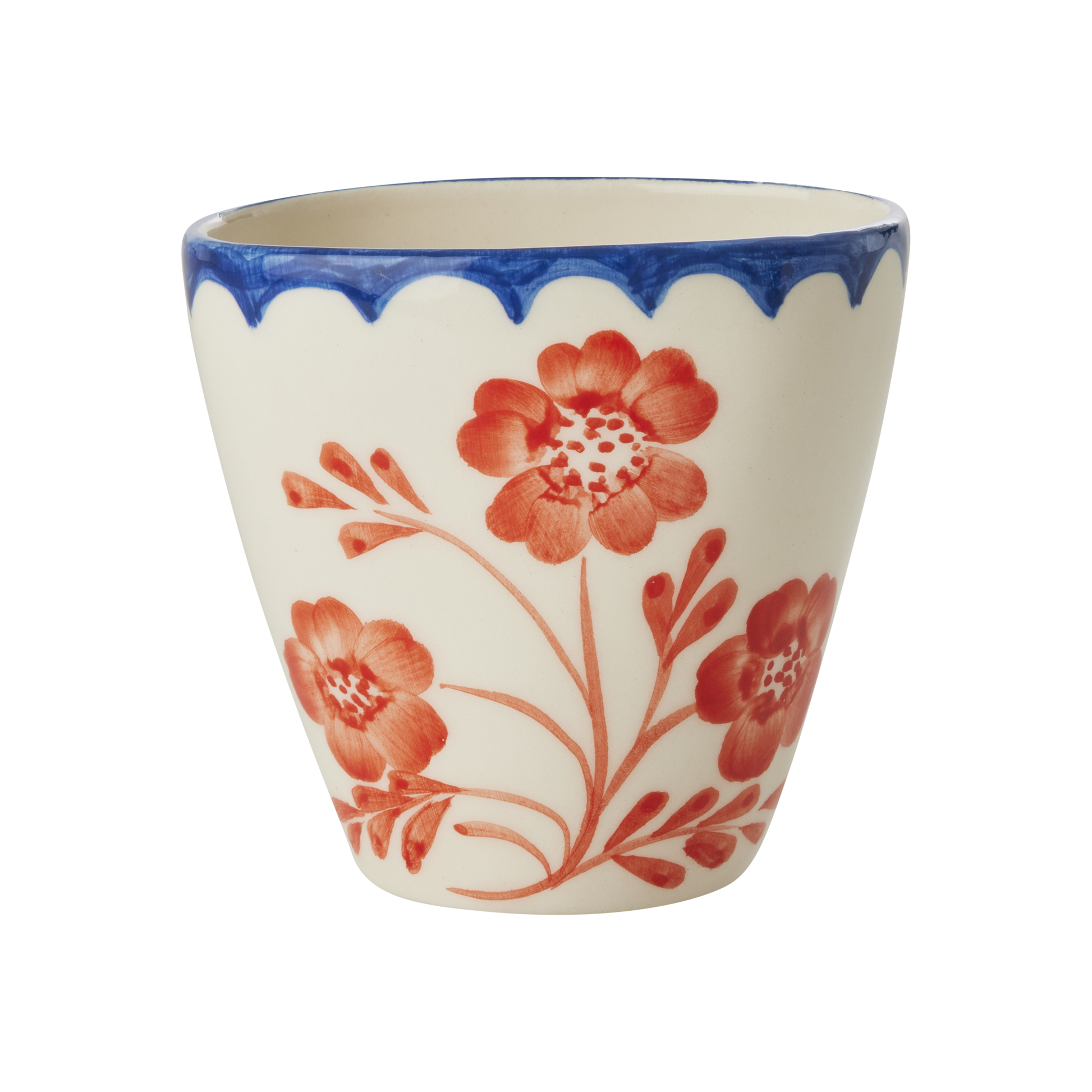 Ceramic cup with red floral design and blue rim on a white background