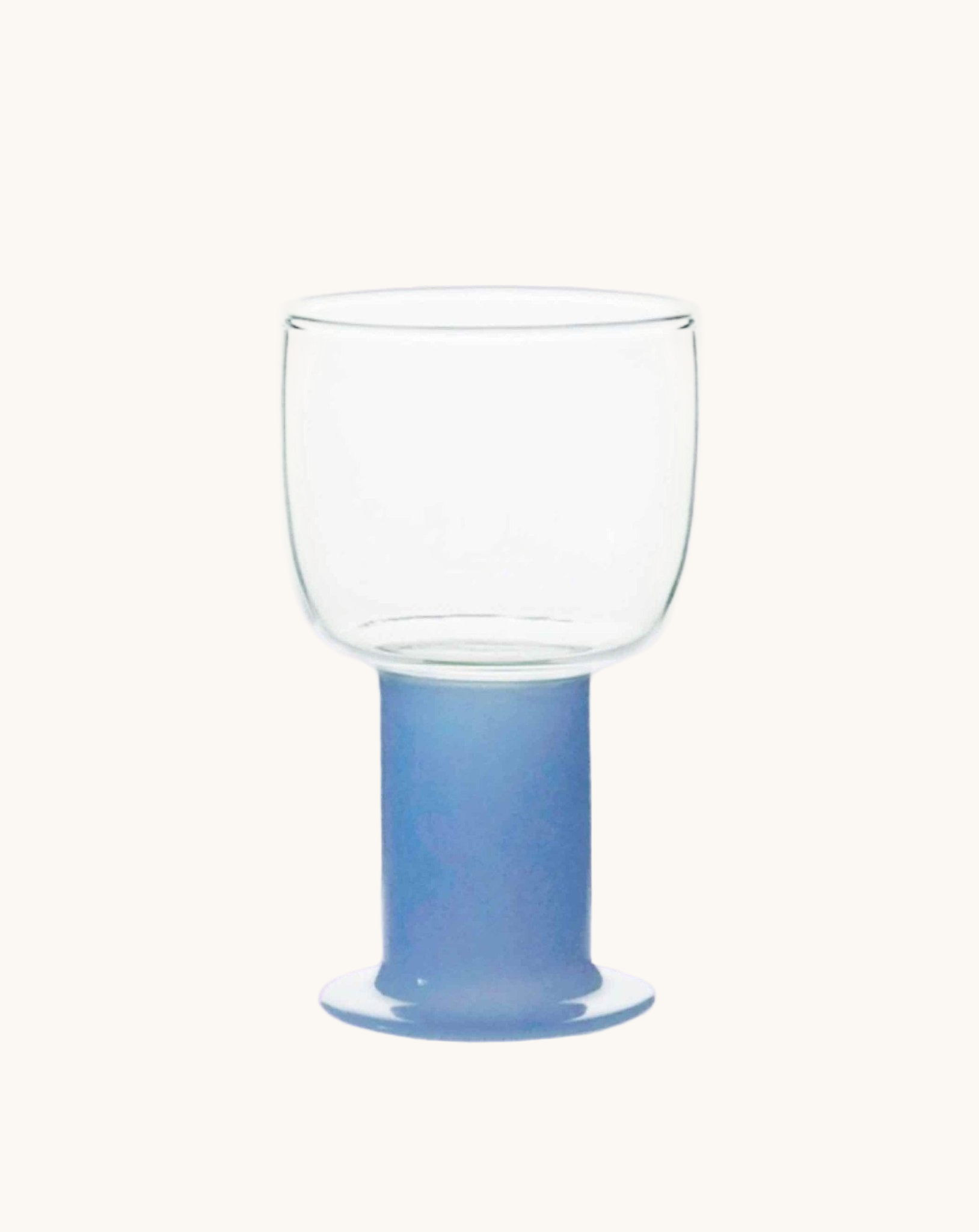 Clear glass with a blue base on a white background