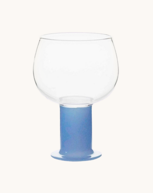 Clear glass with a blue base on a white background