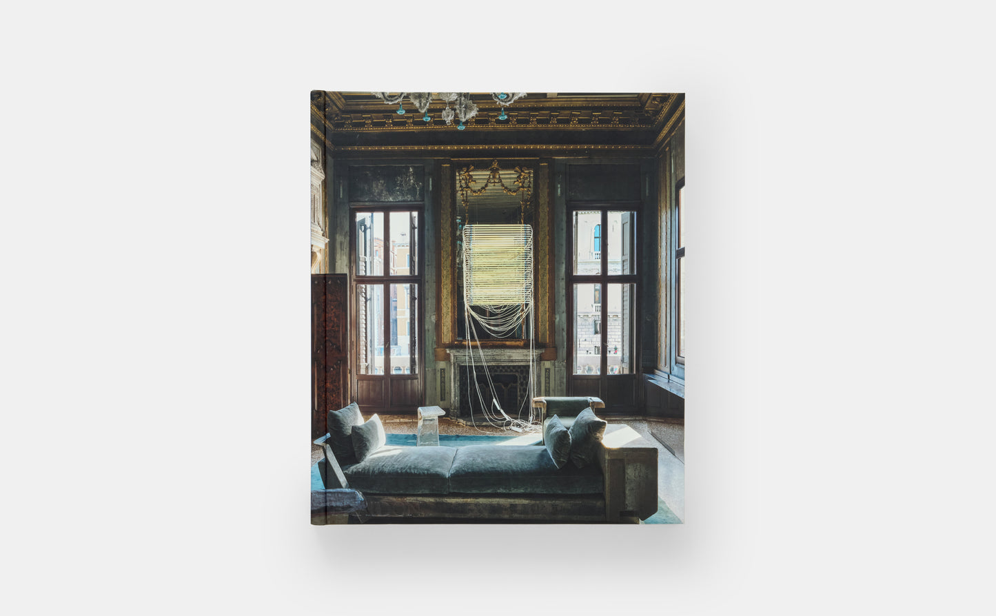 Framed artwork of a classical interior scene with large windows and decorative elements.