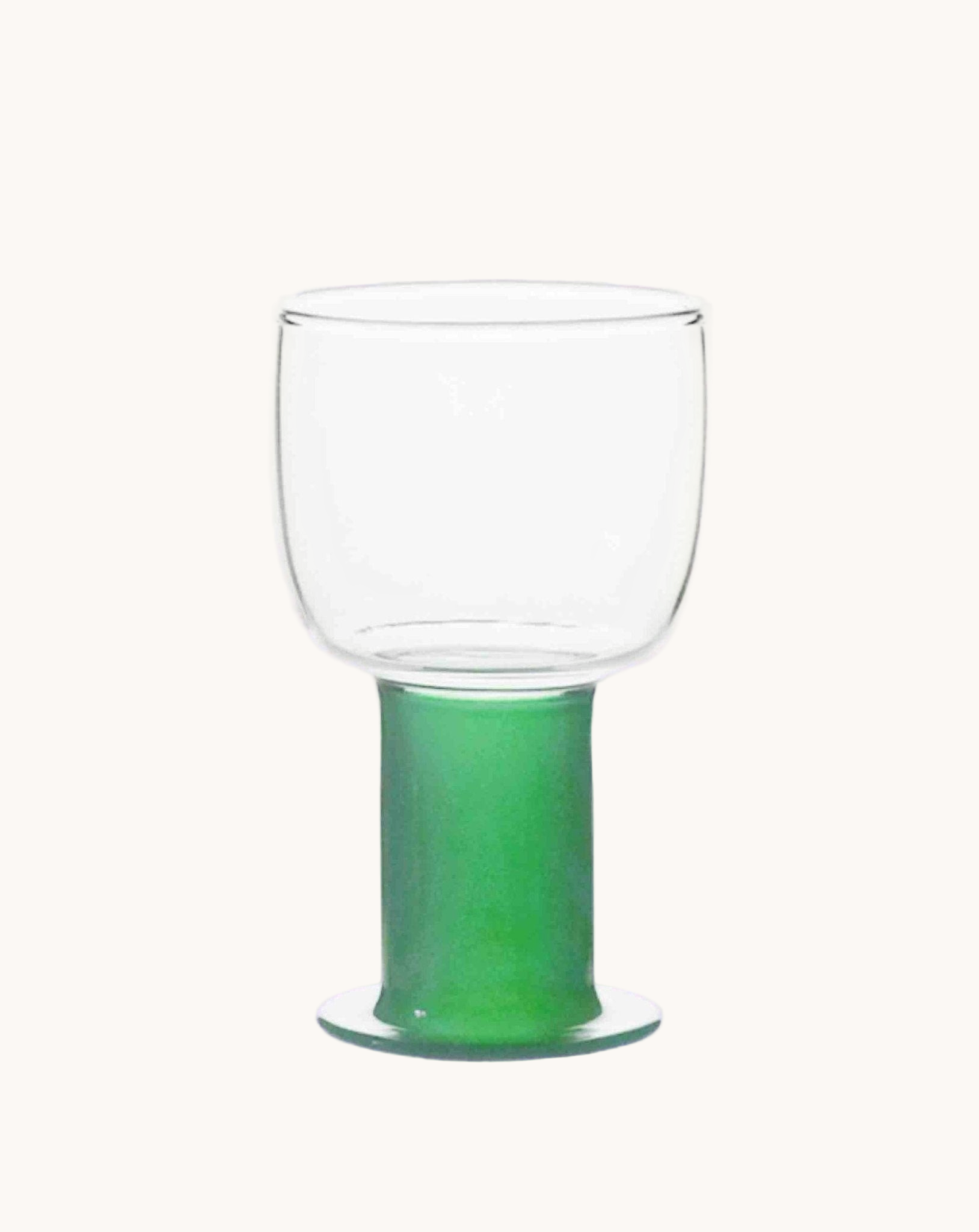 Clear glass with green base on a white background