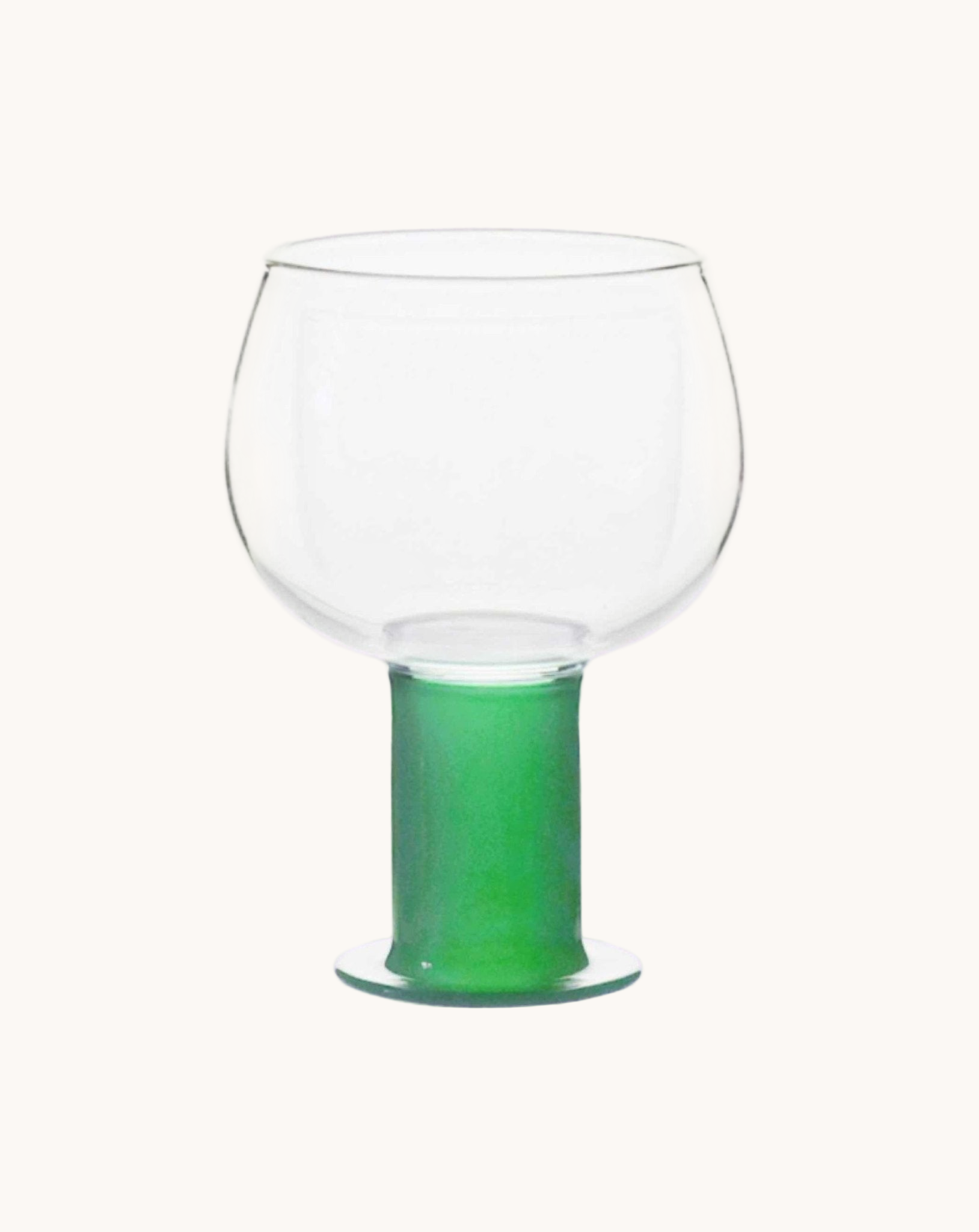 Clear glass with a green base on a white background