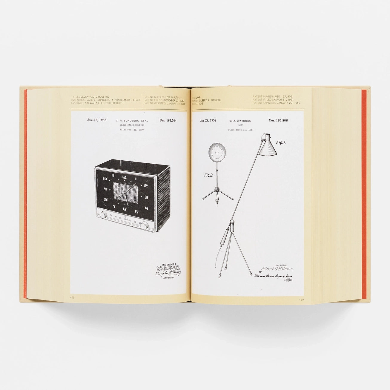 Open book showing patent drawings of a clock and a lamp on beige pages with red binding.
